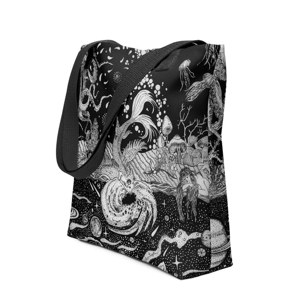 Black tote bag with surreal hand-drawn ink ocean and space artwork, featuring mermaids and jellyfish.